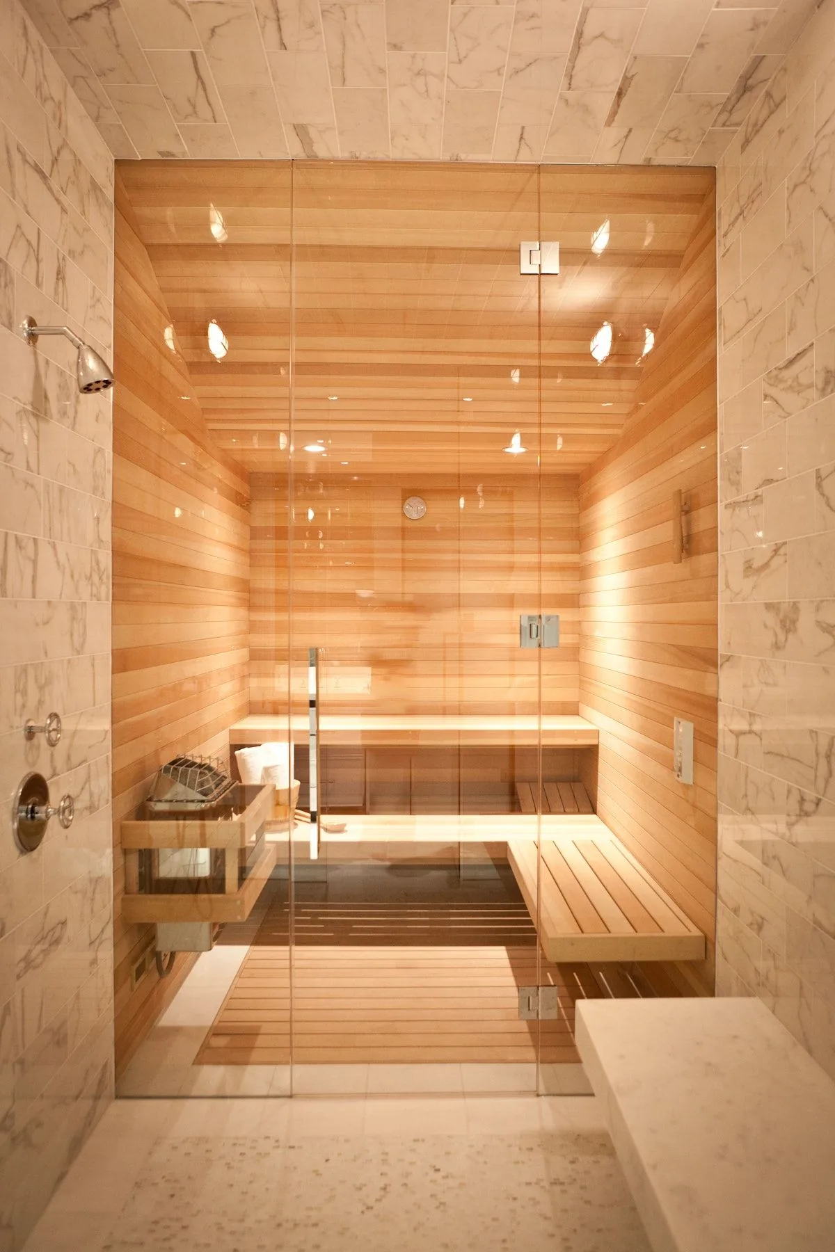 A warm traditional cedar sauna interior at night
